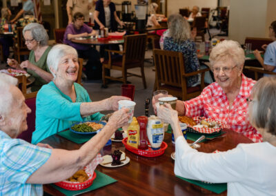 women toasting a dinner table