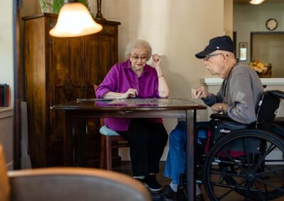 elderly couple working on a puzzle